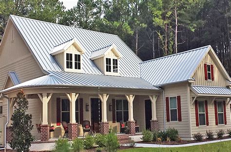 silver metal roof on brick house|homes with brown metal roofs.